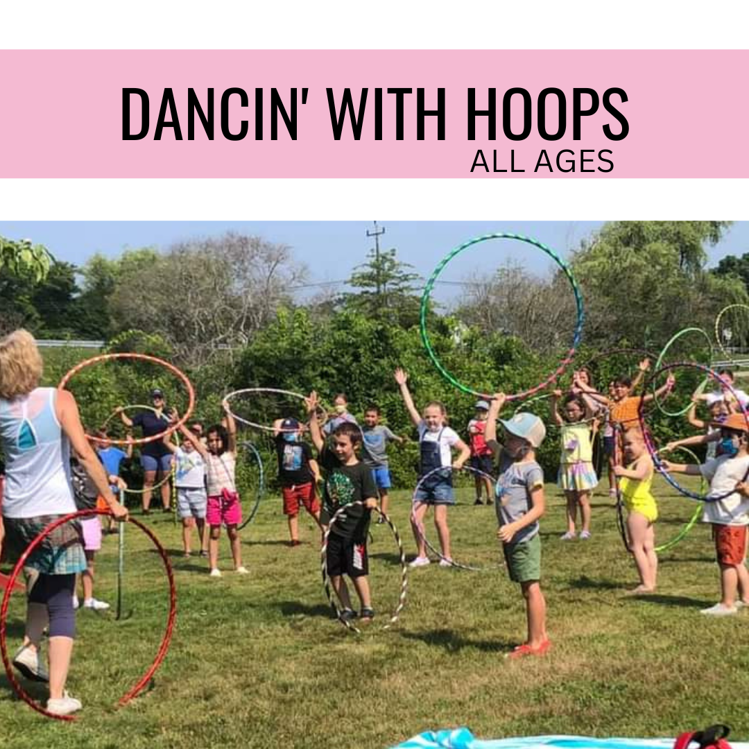 group of children outside twirling hula hoops