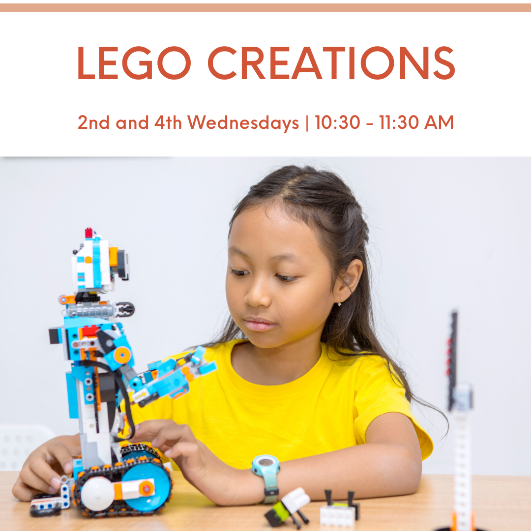 child playing with a Lego Robot