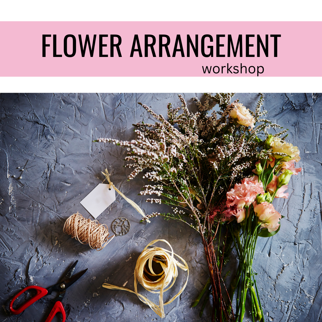 overhead shot of flowers, twine, and scissors