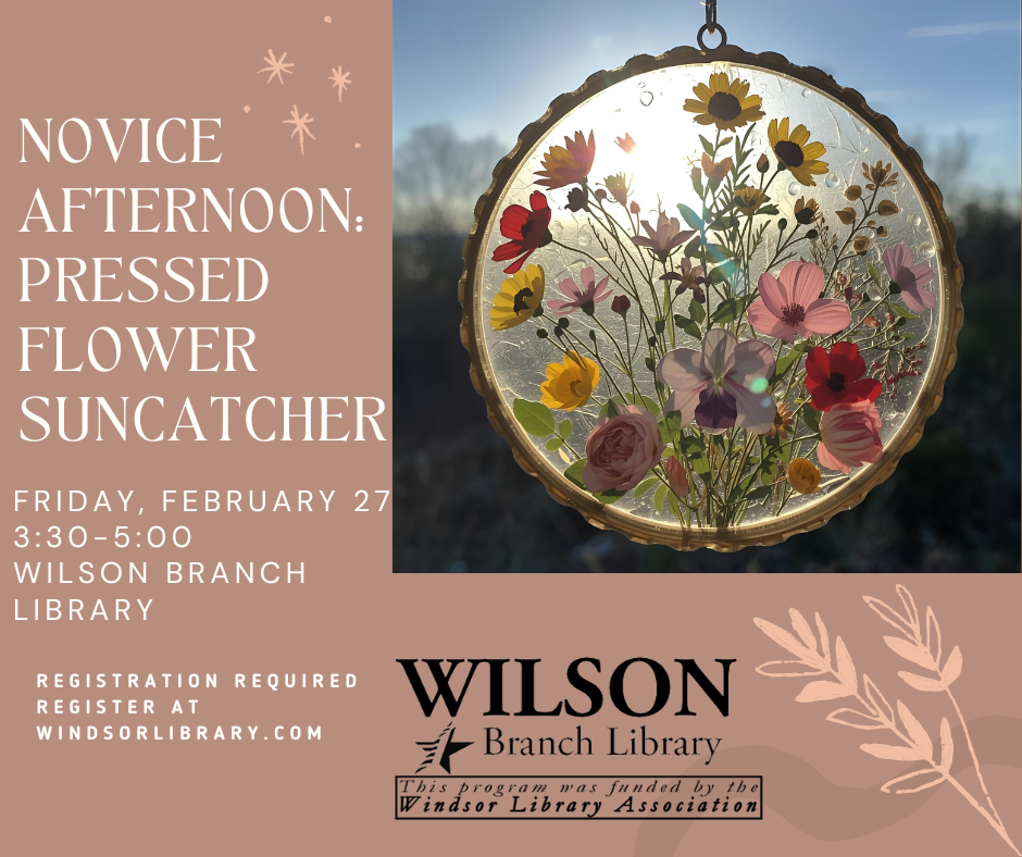 pressed flower suncatcher in a window